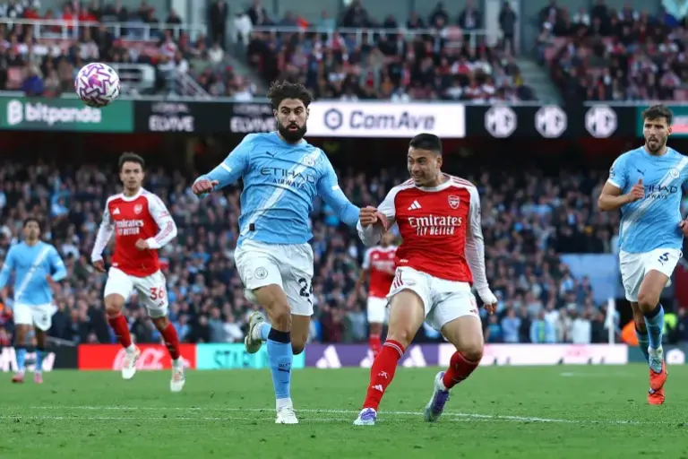 2025-09-21T172717Z_757048191_UP1EL9L1CHFRU_RTRMADP_3_SOCCER-ENGLAND-ARS-MCI-1758475880