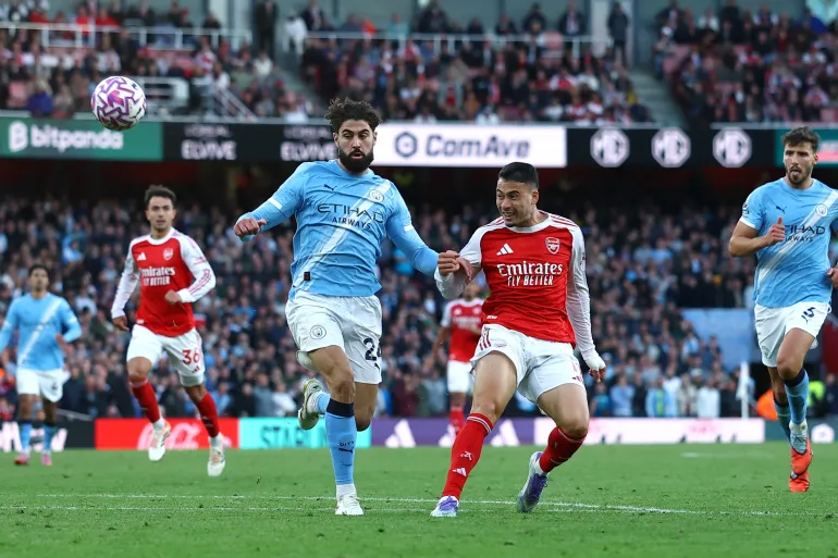 2025-09-21T172717Z_757048191_UP1EL9L1CHFRU_RTRMADP_3_SOCCER-ENGLAND-ARS-MCI-1758475880
