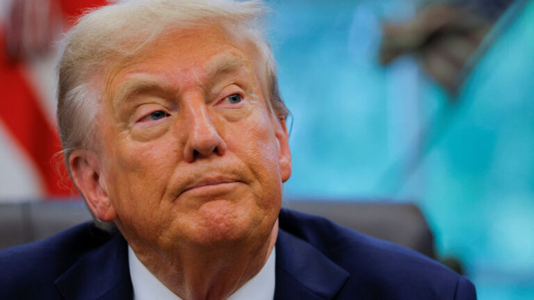 U.S. President Donald Trump signs an executive order at the White House in Washington, D.C.
