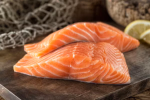 Fresh-salmon-fillets-on-wooden-board-6625956-300x200.avif